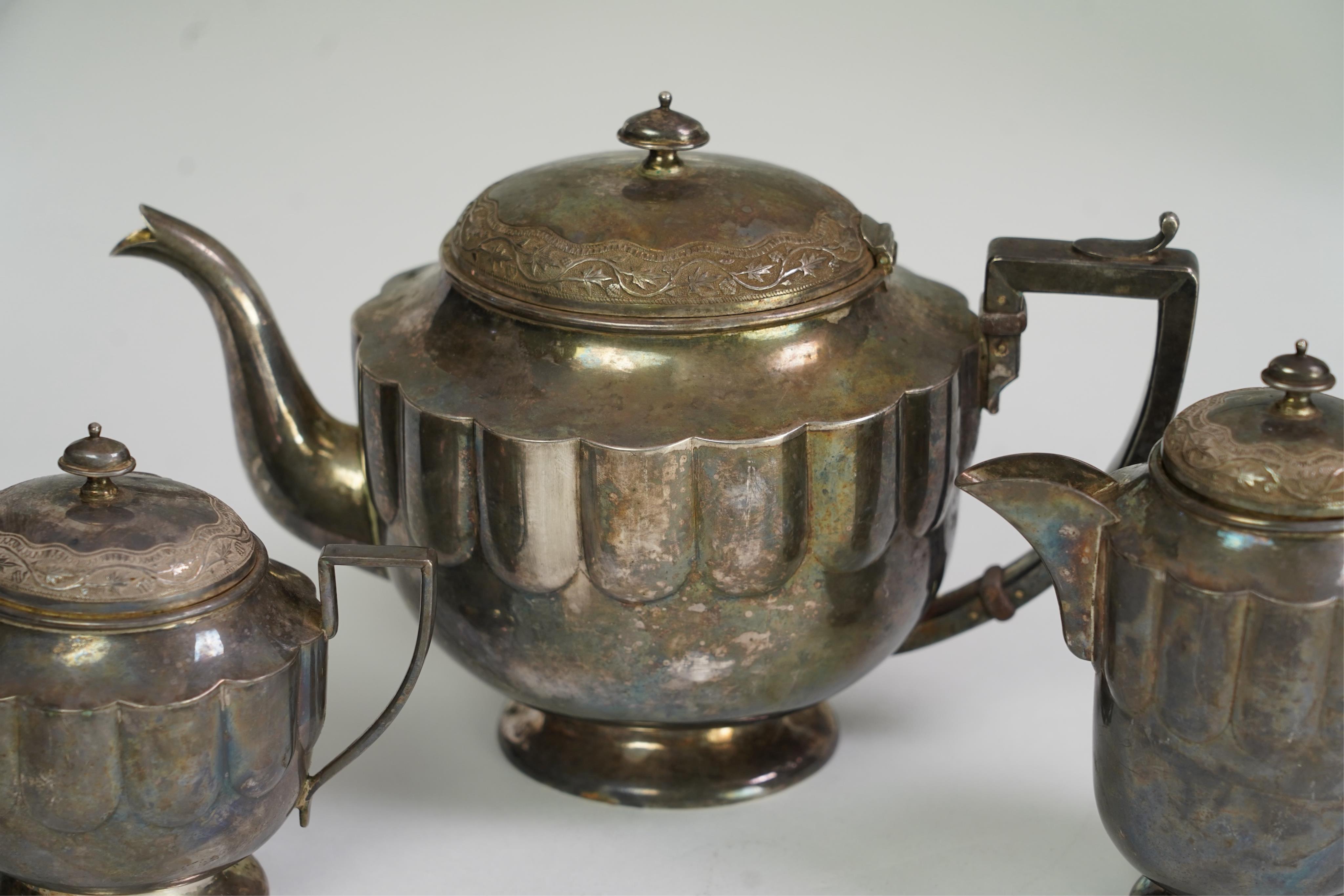 An early 20th century Indian white metal (tests as silver) three piece tea set